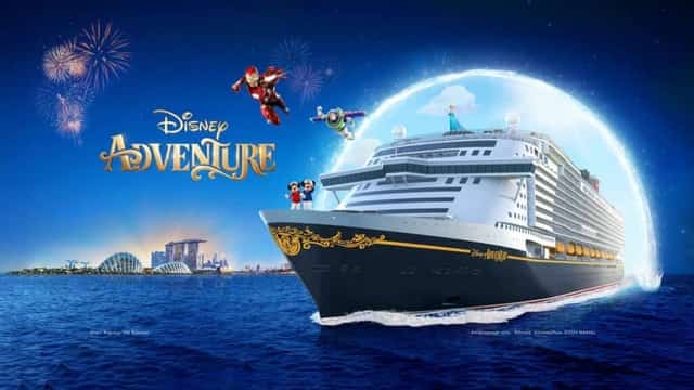 Disney Adventure cruise ship with Mickey, Iron Man and Buzz Lightyear under fireworks